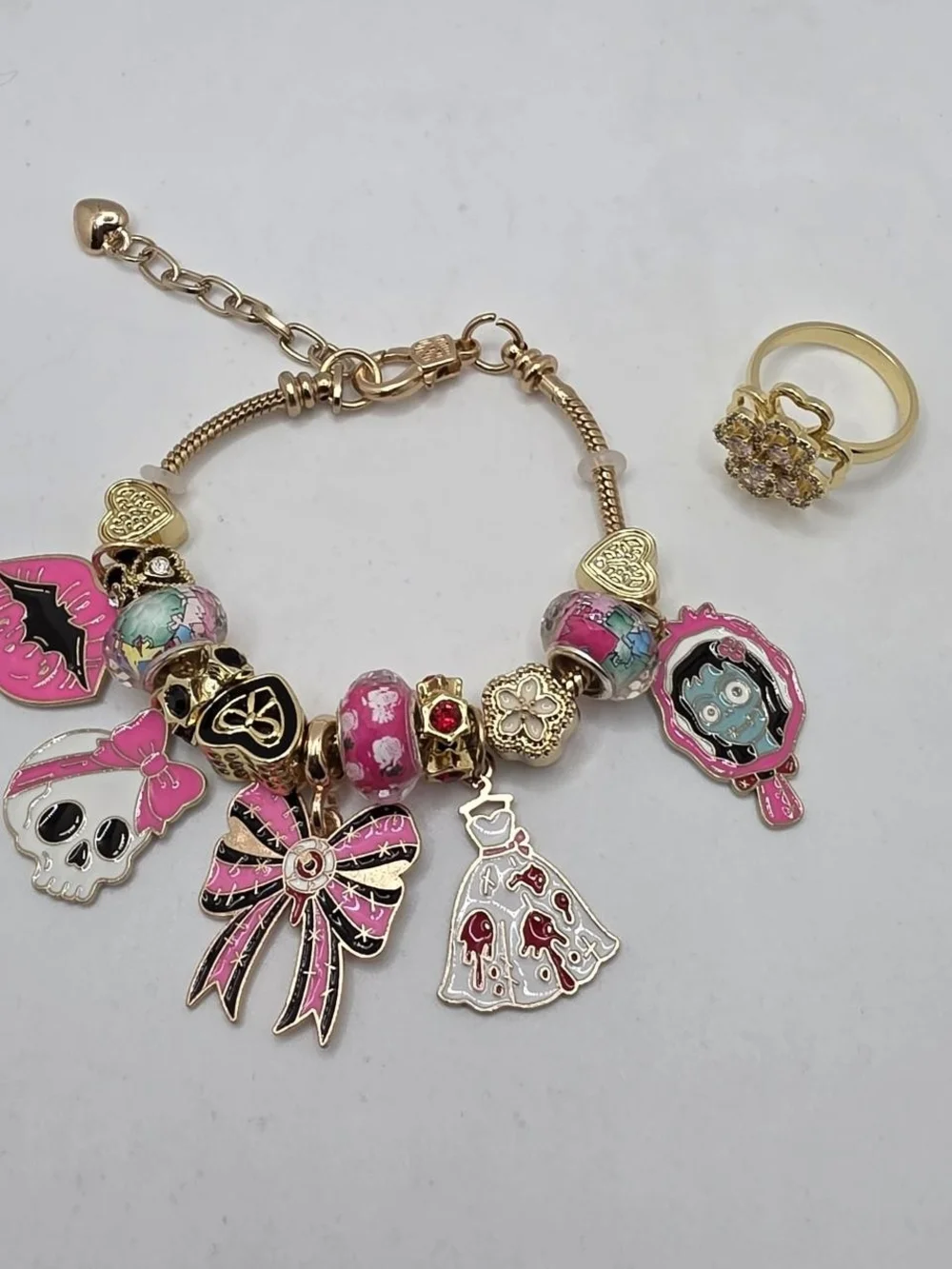 Monster High Pink & Gold Charm Bracelet with Dress, Bow, Skull & Mirror Charms